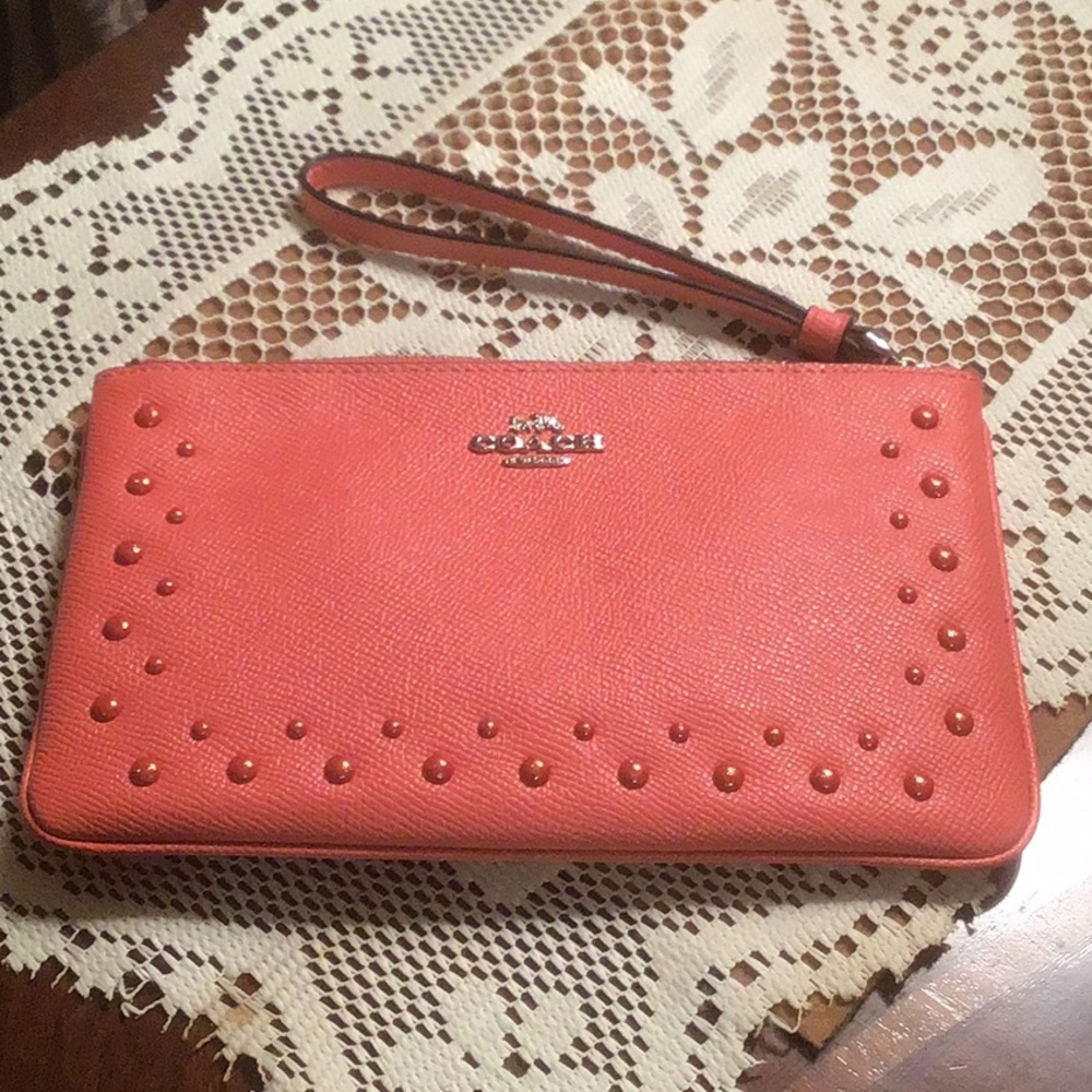 Coach coral wristlet with sparkle dots.NWOT